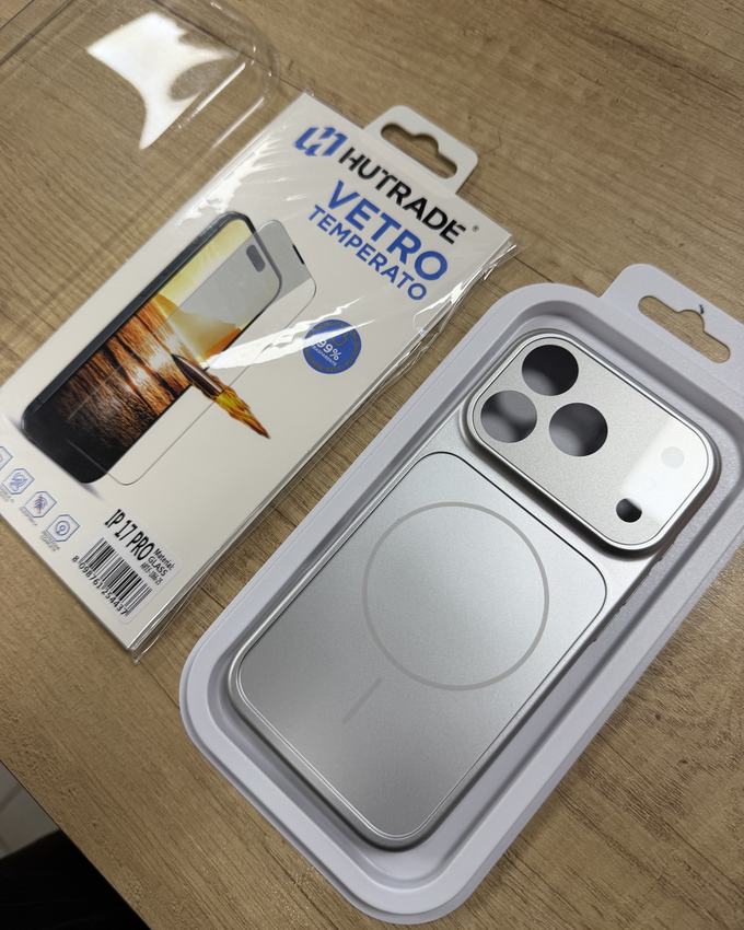 A tempered glass pack and a silver iPhone case
